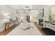 Bright, open living room with coffered ceilings, fireplace, and neutral decor at 1211 New Grissom Way, Wake Forest, NC 27587