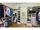 Spacious walk-in closet with custom shelving and window providing natural light at 1211 New Grissom Way, Wake Forest, NC 27587