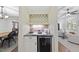 A cozy wine bar includes wine storage, counterspace, and elegant lighting at 1211 New Grissom Way, Wake Forest, NC 27587