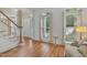 Elegant foyer with hardwood floors, staircase, and a welcoming front door with sidelights at 123 W Camden Forest Dr, Cary, NC 27518