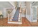 Elegant foyer with hardwood floors, staircase, and high ceilings, creating a grand entrance at 123 W Camden Forest Dr, Cary, NC 27518