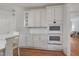 Bright kitchen with custom cabinets, double ovens, and a breakfast bar at 123 W Camden Forest Dr, Cary, NC 27518