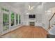 Spacious living room with vaulted ceilings, built-in bookshelves, and a fireplace at 123 W Camden Forest Dr, Cary, NC 27518