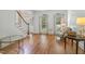 Hardwood floors and ample natural light enhance this inviting living space, great for relaxation at 123 W Camden Forest Dr, Cary, NC 27518
