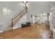 Open living area featuring a staircase, hardwood floors, and access to the kitchen at 123 W Camden Forest Dr, Cary, NC 27518