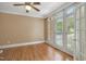 Bright room with hardwood floors, natural light, and a view through the French doors at 123 W Camden Forest Dr, Cary, NC 27518