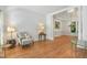 Spacious living room with elegant decor, hardwood floors, and natural light, perfect for entertaining at 123 W Camden Forest Dr, Cary, NC 27518
