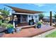 Cozy backyard deck with a stylish shed, comfortable seating, and an inviting outdoor entertainment space at 1254 Salters St, Burlington, NC 27215