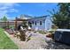 Charming backyard features a custom shed with deck, a fire pit area, and comfortable seating for outdoor enjoyment at 1254 Salters St, Burlington, NC 27215