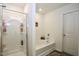 Clean bathroom featuring a glass-enclosed shower and a separate soaking tub at 1254 Salters St, Burlington, NC 27215