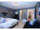 Spacious bedroom with sports decor, comfortable bed, and an adjacent doorway at 1254 Salters St, Burlington, NC 27215