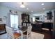 Kitchen with dark cabinets, granite countertops, stainless appliances, and eat-in dining at 1254 Salters St, Burlington, NC 27215