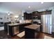Well-designed kitchen with stainless steel appliances, a center island, and granite countertops at 1254 Salters St, Burlington, NC 27215