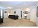 Upstairs living room area with neutral paint, carpet, and lounge seating at 1254 Salters St, Burlington, NC 27215