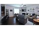 Inviting living room with a fireplace, ceiling fan, and a variety of decorative wall art pieces at 1254 Salters St, Burlington, NC 27215