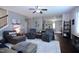 Inviting living room with dark wood floors and stairs and a view into the kitchen at 1254 Salters St, Burlington, NC 27215