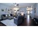 Comfortable living room featuring dark wood floors, stairs, and decorative wall art at 1254 Salters St, Burlington, NC 27215