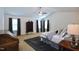 Bright and airy main bedroom with a ceiling fan and neutral paint at 1254 Salters St, Burlington, NC 27215