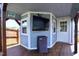 Custom backyard shed with a TV and outdoor grilling area, perfect for entertaining and enjoying outdoor living at 1254 Salters St, Burlington, NC 27215