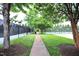 Outdoor recreational area featuring tennis courts, walking paths, and landscaped green spaces at 1254 Salters St, Burlington, NC 27215