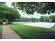 Outdoor recreational area featuring a sand volleyball court, tennis courts, and well-manicured landscaping at 1254 Salters St, Burlington, NC 27215