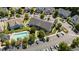 Aerial view of townhouses, community pool, parking, and lush surroundings at 1313 Legacy Greene Ave, Wake Forest, NC 27587