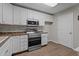 The kitchen has stainless steel appliances, including a microwave and an oven at 1313 Legacy Greene Ave, Wake Forest, NC 27587