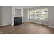 Comfortable living room with a fireplace and ample natural light at 1313 Legacy Greene Ave, Wake Forest, NC 27587