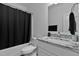 Bright bathroom featuring granite countertops, modern fixtures, and a shower-tub combo at 136 Hatchet Cv, Louisburg, NC 27549