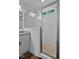This bright bathroom features a modern glass-enclosed shower with sleek fixtures at 136 Hatchet Cv, Louisburg, NC 27549