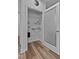 Spacious pantry with adjustable shelving and wood flooring at 136 Hatchet Cv, Louisburg, NC 27549