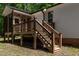 A close up shot of the wooden porch and stairs at 136 Hatchet Cv, Louisburg, NC 27549