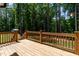 Wooden porch with a view of the forest at 136 Hatchet Cv, Louisburg, NC 27549