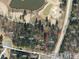 Aerial view of a lot with nearby roadways and golf course at 14 Duck Bill Trl, Pittsboro, NC 27312