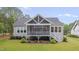 Exterior of house with landscaped backyard and screened porch at 14 Duck Bill Trl, Pittsboro, NC 27312