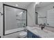 Modern bathroom featuring sleek black fixtures, granite countertops, subway tile shower, and a glass door at 14 Duck Bill Trl, Pittsboro, NC 27312
