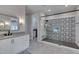 Bathroom featuring modern fixtures, vanity with storage, and walk-in shower with decorative tile at 14 Duck Bill Trl, Pittsboro, NC 27312