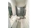 Updated bathroom with gray tiled walk-in shower and granite vanity at 14 Duck Bill Trl, Pittsboro, NC 27312