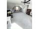 Spacious bedroom with ceiling fan, plush carpeting, and stylish furnishings at 14 Duck Bill Trl, Pittsboro, NC 27312