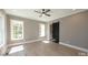 Bright bedroom with a ceiling fan, light hardwood floors and natural light at 14 Duck Bill Trl, Pittsboro, NC 27312