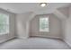 Bright bedroom with two windows and neutral carpet at 14 Duck Bill Trl, Pittsboro, NC 27312