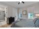 Comfortable bedroom with two windows and access to en suite bath featuring modern fixtures at 14 Duck Bill Trl, Pittsboro, NC 27312
