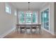 Light-filled dining room featuring large windows and sliding door at 14 Duck Bill Trl, Pittsboro, NC 27312