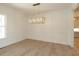 Elegant dining room showcasing wainscoting, hardwood floors, and a stylish chandelier at 14 Duck Bill Trl, Pittsboro, NC 27312