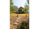 Back exterior of home with a screened-in porch and backyard at 14 Duck Bill Trl, Pittsboro, NC 27312