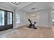 The expansive foyer has a view of the home gym and an updated front door at 14 Duck Bill Trl, Pittsboro, NC 27312