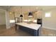 Modern kitchen featuring a large island, stainless steel appliances, and custom cabinetry at 14 Duck Bill Trl, Pittsboro, NC 27312