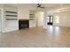 Bright living room with fireplace, built-ins, hardwood floors, and an open floor plan at 14 Duck Bill Trl, Pittsboro, NC 27312