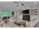 Comfortable living room with a fireplace, a TV, and access to a deck at 14 Duck Bill Trl, Pittsboro, NC 27312