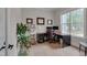 Bright home office with large windows, hardwood floors, and traditional office furniture at 14 Duck Bill Trl, Pittsboro, NC 27312